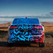 Volkswagen ID.7 debuts with trippy camo at CES – EV sedan with 700 km of range; launch in Q2 this year