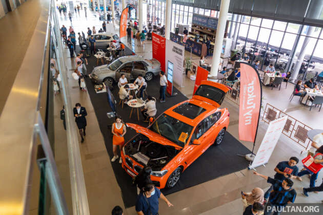 EVx 2023: myTukar display of half-and-half refurbished car, plus 35% off respray packages today at SCCC