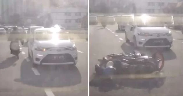 Motorcyclist kicks merging Toyota Vios, then crashes