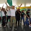 Mercedes GP F1 driver Nico Rosberg refuels lucky customers’ cars at Petronas’ 1,001st station