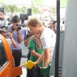 Mercedes GP F1 driver Nico Rosberg refuels lucky customers’ cars at Petronas’ 1,001st station