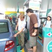 Mercedes GP F1 driver Nico Rosberg refuels lucky customers’ cars at Petronas’ 1,001st station