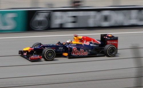 vettel-sepang Malaysian GP: Smooth Friday practice for Red Bull – we hang out with the champs (sort of) in their garage!